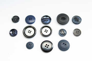 black buttons on a white background