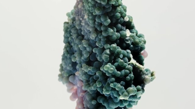 grape agate mineral gemstone from indonesia,also called Botryoidal Purple Chalcedony. White background