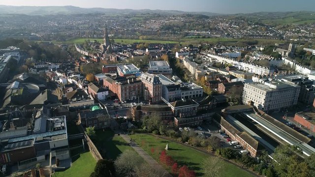 Aerial of Exeter, The college, Exeter central station, and northernhay gardens all in the foreground. Student city