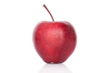 One whole red delicious apple isolated on white