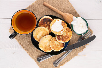 Group of six whole cheese pancake for breakfast on white wood