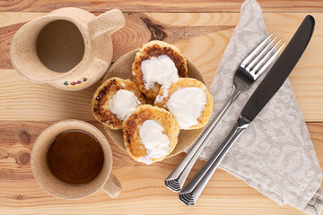 Group of four whole cheese pancake for breakfast on wood
