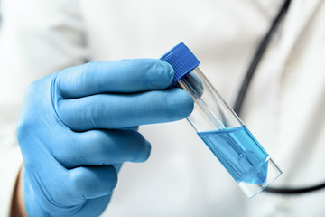 Researcher in the laboratory preparing a sample of antibiotic for the vaccination campaign /...