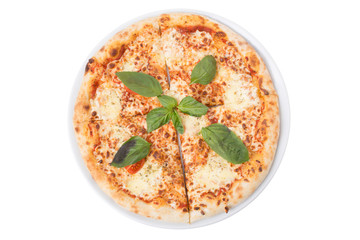 The pizza margherita is decorated twig basilic.