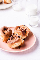 Cinnamon buns   in plate on morning table