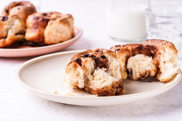 Freshly baked cinnamon buns on morning table