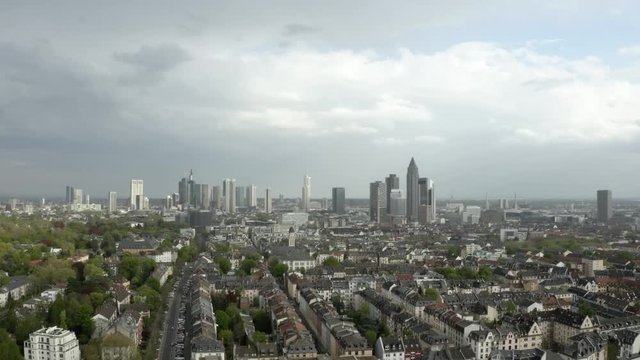 Slow Dolly in to the skyline of Frankfurt with suburban Houses in  the Foreground