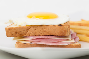 Fragment of sandwich with ham and cheese.