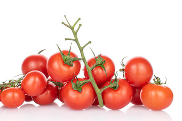 Lot of whole fresh red cherry tomato isolated on white