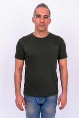 Fototapeta premium Portrait of handsome Persian man looking at camera