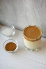 Dalgona coffee is a trendy drink from Korea. Popular whipped coffee with cold milk.