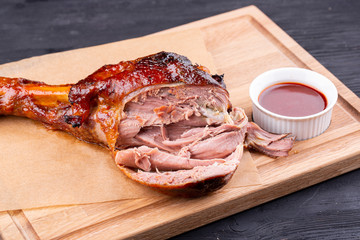 Pig roll baked on grill with crispy crust is served with ketchup