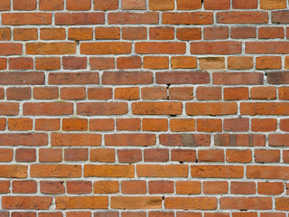 Brick wall of red brick in an old house.