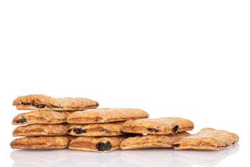 Lot of whole square puff cookie with raisins isolated on white