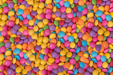Fototapeta na wymiar Color chocolate candies - smarties background
