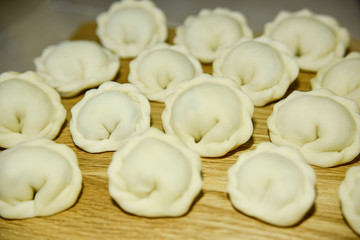 Fototapeta na wymiar many round dumplings from the close side view