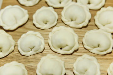 Fototapeta na wymiar many round dumplings from the close top view