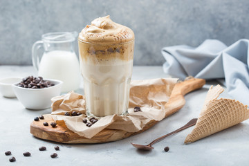 food Trend - dalgona coffee, whipped instant drink on rustic background, copy space