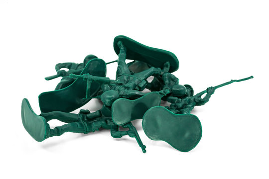Green toy soldiers on white background. Group of military toys. Picture two on four (2/4).