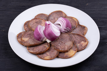 Meat plate with meat stock with red onions