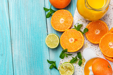 Making Refreshing Orange Juice. Border Background, Top View over Ingredients
