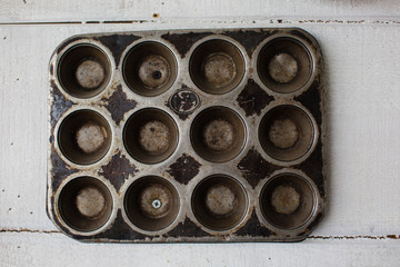 Different types of baking pans and moulds for cake, bread and muffins.