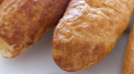 Fresh bread, french baton, tiger bread and small baguettes close up, with shallow depth of focus