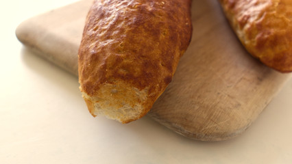 Fresh bread, french baton, tiger bread and small baguettes close up, with shallow depth of focus
