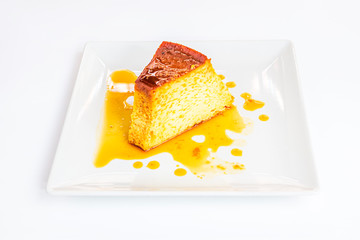 Portion of pudding on white plate
