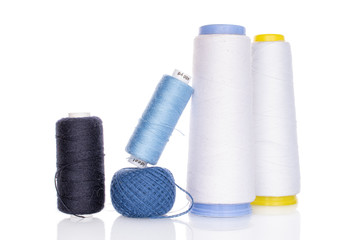 Group of five whole thread spool isolated on white
