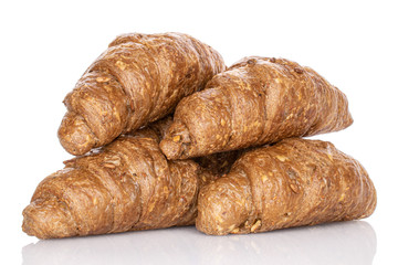 Group of four whole baked wholegrain croissant isolated on white