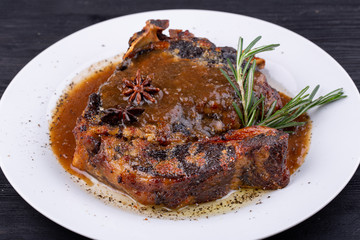  Fried pork meat baked in an oven with sauce and spices