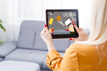 Portrait of a young creative woman as a web designer or artist, working on a digital tablet at home. Concept of a freelance and creative work online
