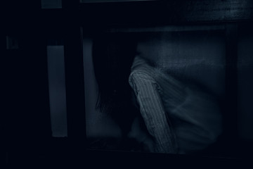 Portrait of asian woman make up ghost face with blood,Horror scene,Scary background,Halloween...