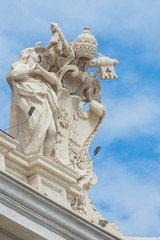 Fototapeta na wymiar Vatican, Rome / Italy 10.02.2015.Statues on the roofs of the Papal Basilica of Saint Peter in the Vatican