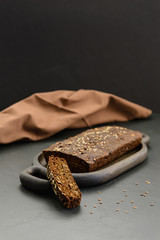 Homemade linseed bread on a wooden board. Healthy food, gluten free, sugar free, lactose free.