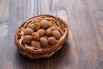 small chocolate eggs in a small basket