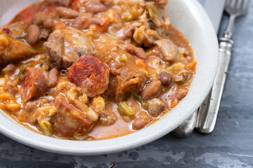 typical portuguese dish Feijoada in gray dish