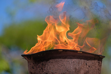 memorial fire in a soldiers helmet