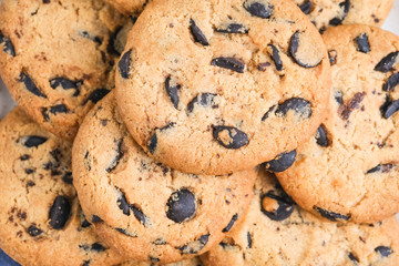 Cookies with chocolate on rustic background close-up.