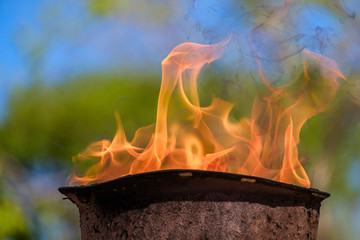 memorial fire in a soldiers helmet