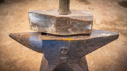 Rare old iron anvil with hammer