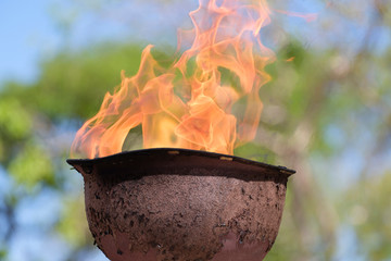 memorial fire in a soldiers helmet