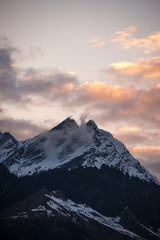 Fototapeta na wymiar Snow-capped mountain peaks of the Himalayas during sunset