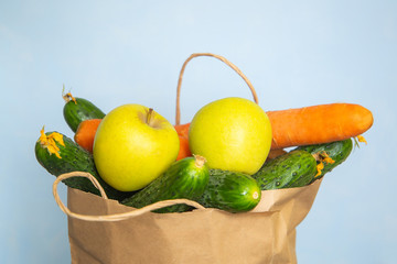  donation food box vegetables fruits on a blue background