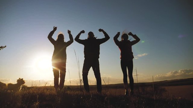 happy family teamwork silhouette jumping for joy and happiness. concept success victory in business goal achievement. a group lifestyle of people jump rejoice shout