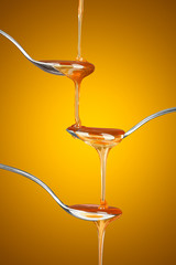 Trickling down spoons of honey