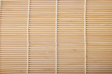 Sushi mat made of bamboo on white background