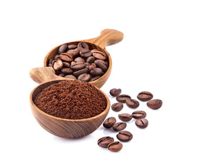 Coffee beans and ground coffee in wooden spoon on white background. Coffee   beans isolated.