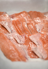 Detail with fresh salmon fillet on ice in a supermarket